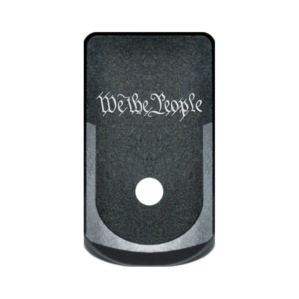 We The People Text laser engraved on a grip extended magazine base plate for Glock 43
